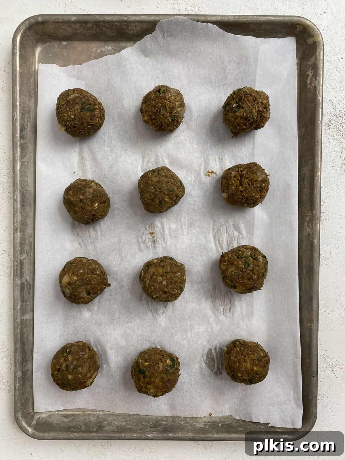 Mighty Lentil Meatballs 16 process shot post adding lentil meatballs to baking tray pre baking