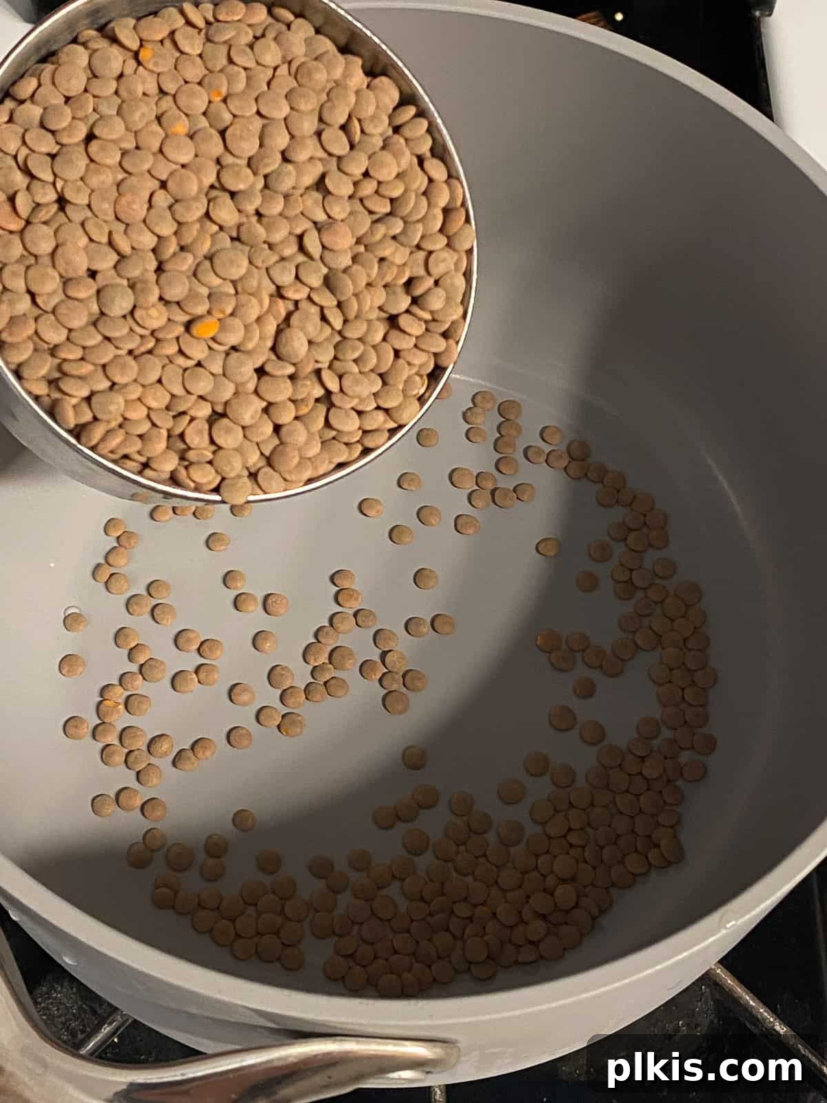 Mighty Lentil Meatballs 4 process shot of adding lentils to pot