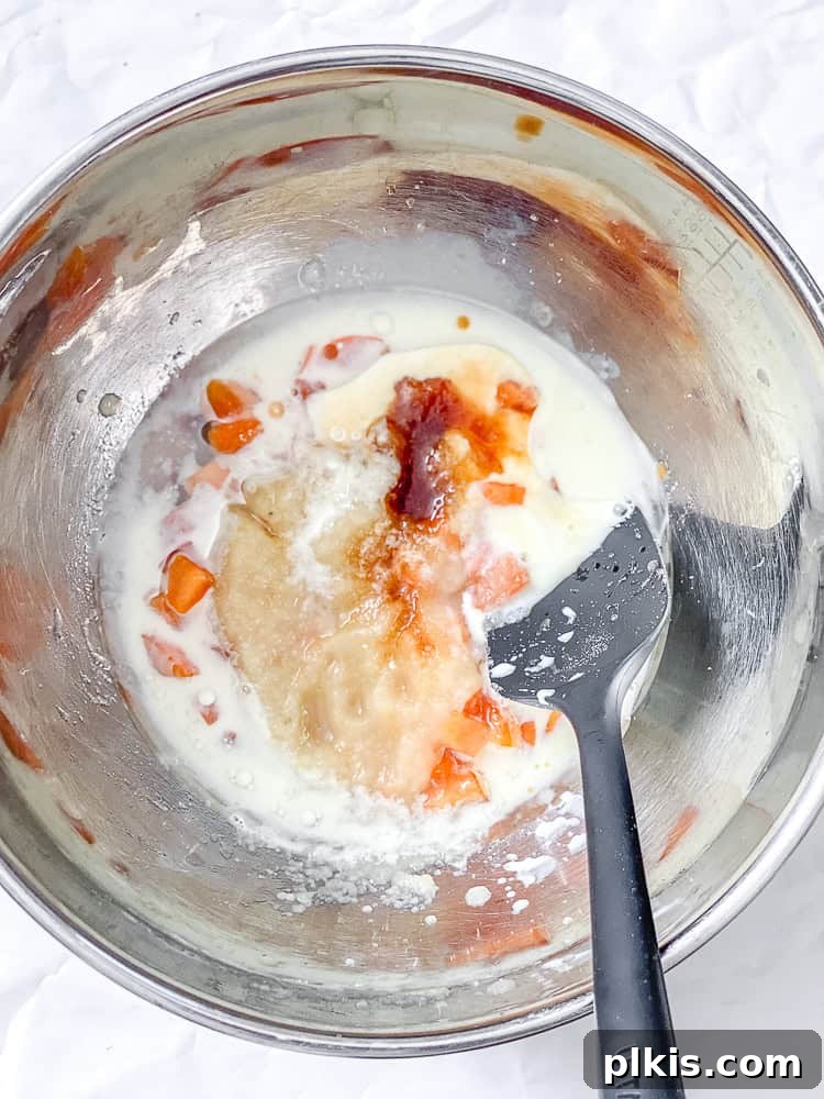 process shot showing mixing wet ingredients in a bowl