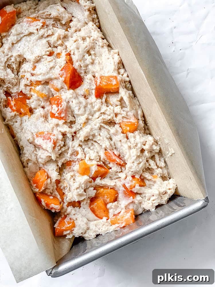 process shot showing batter for persimmon bread in bread pan