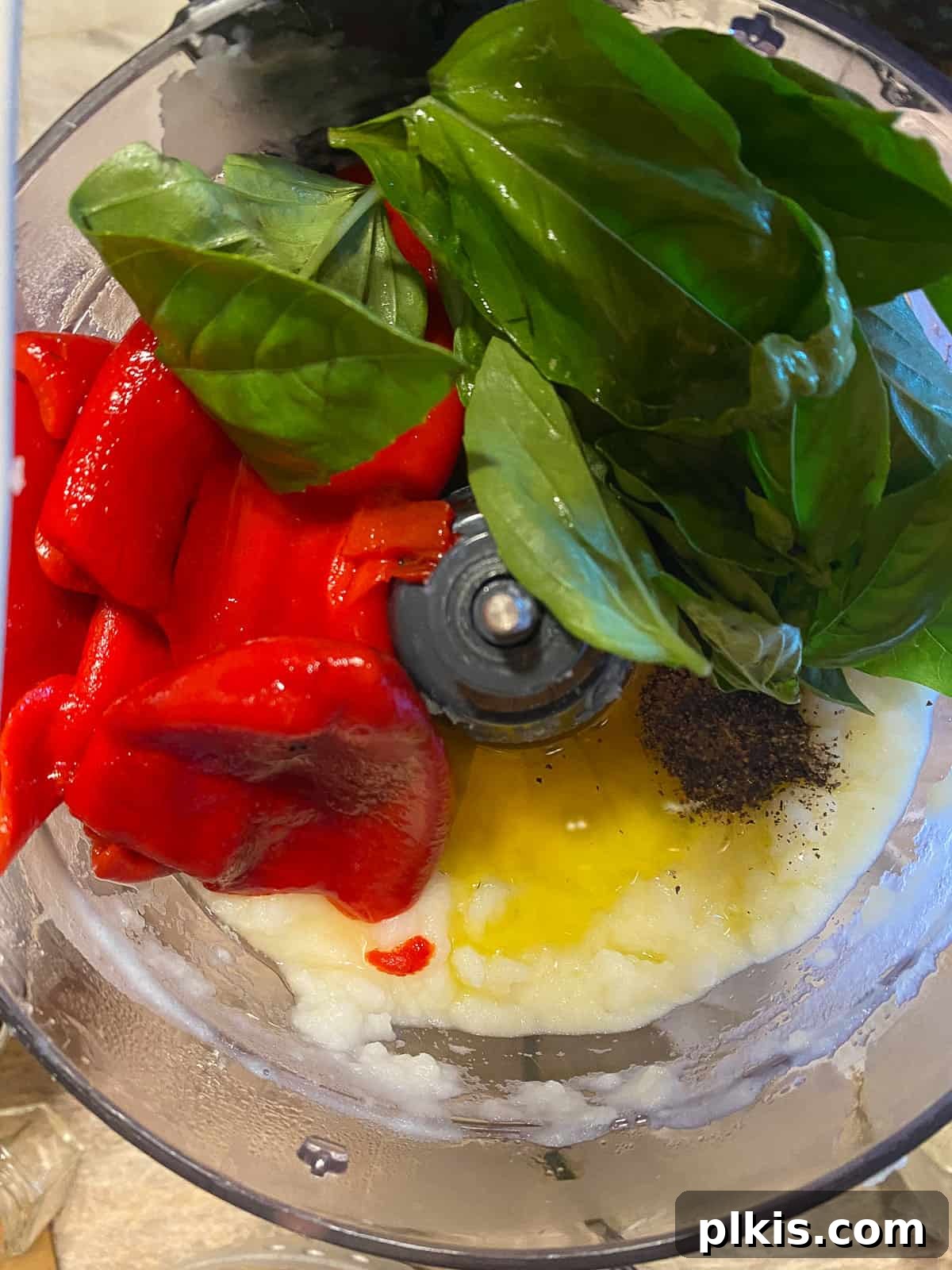 Velvety Roasted Red Pepper Soup 8 Fresh basil and roasted red bell peppers added to the food processor with the potato-milk mixture.