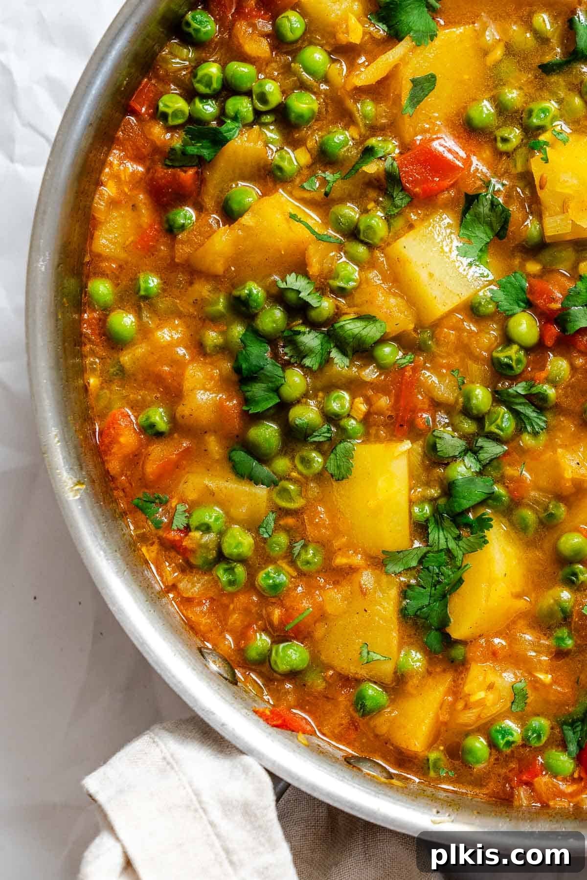 Spiced Potato & Pea Curry Made Simple 2 Completed Easy Potato and Pea Curry (Aloo Matar) in pot.