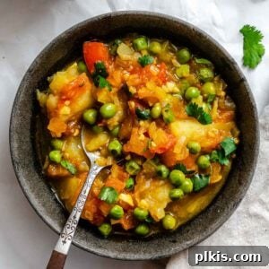 Completed Easy Potato and Pea Curry (Aloo Matar) in pot and bowl