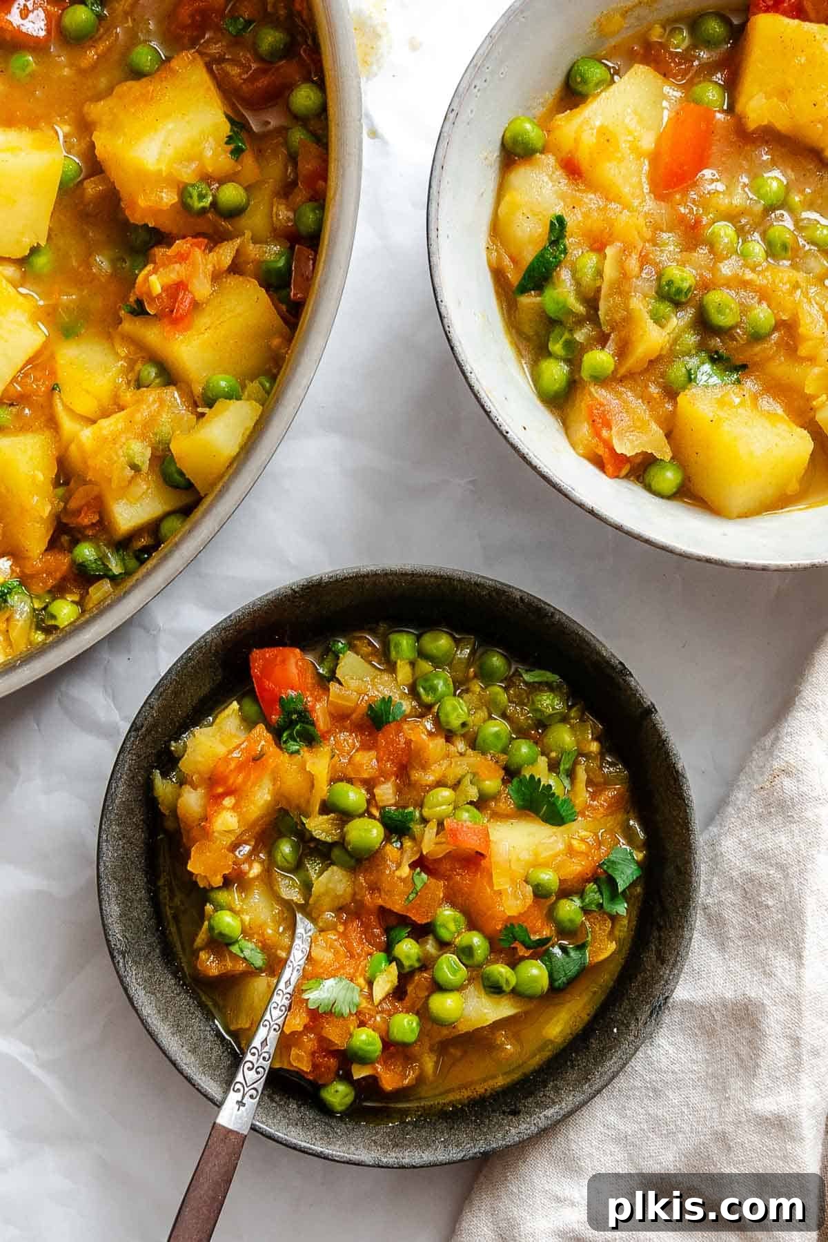Spiced Potato & Pea Curry Made Simple 9 Completed Easy Potato and Pea Curry (Aloo Matar) in pot and bowl