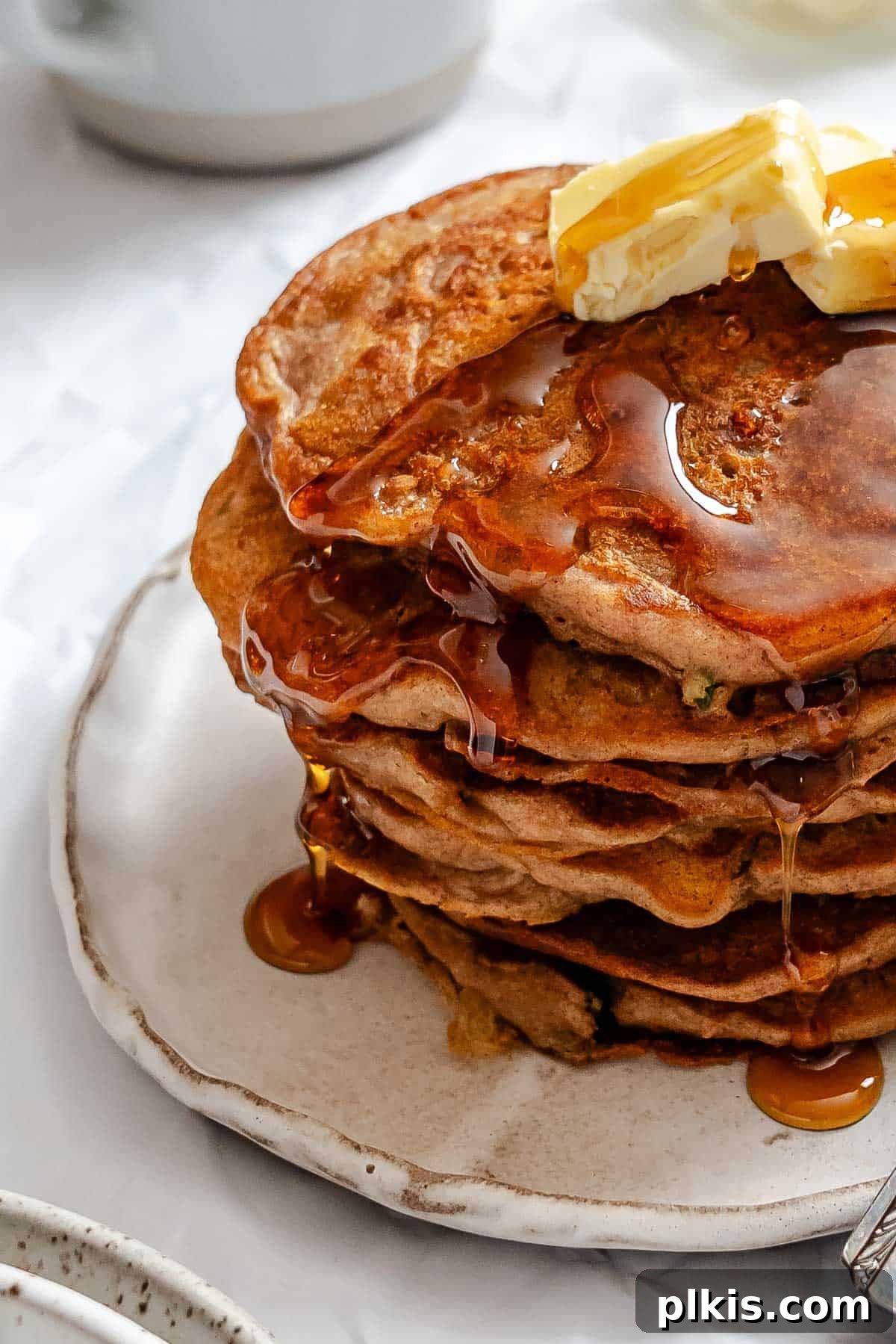 Spiced Carrot Cake Pancakes 8 Completed stack of Carrot Cake Pancakes on a plate.