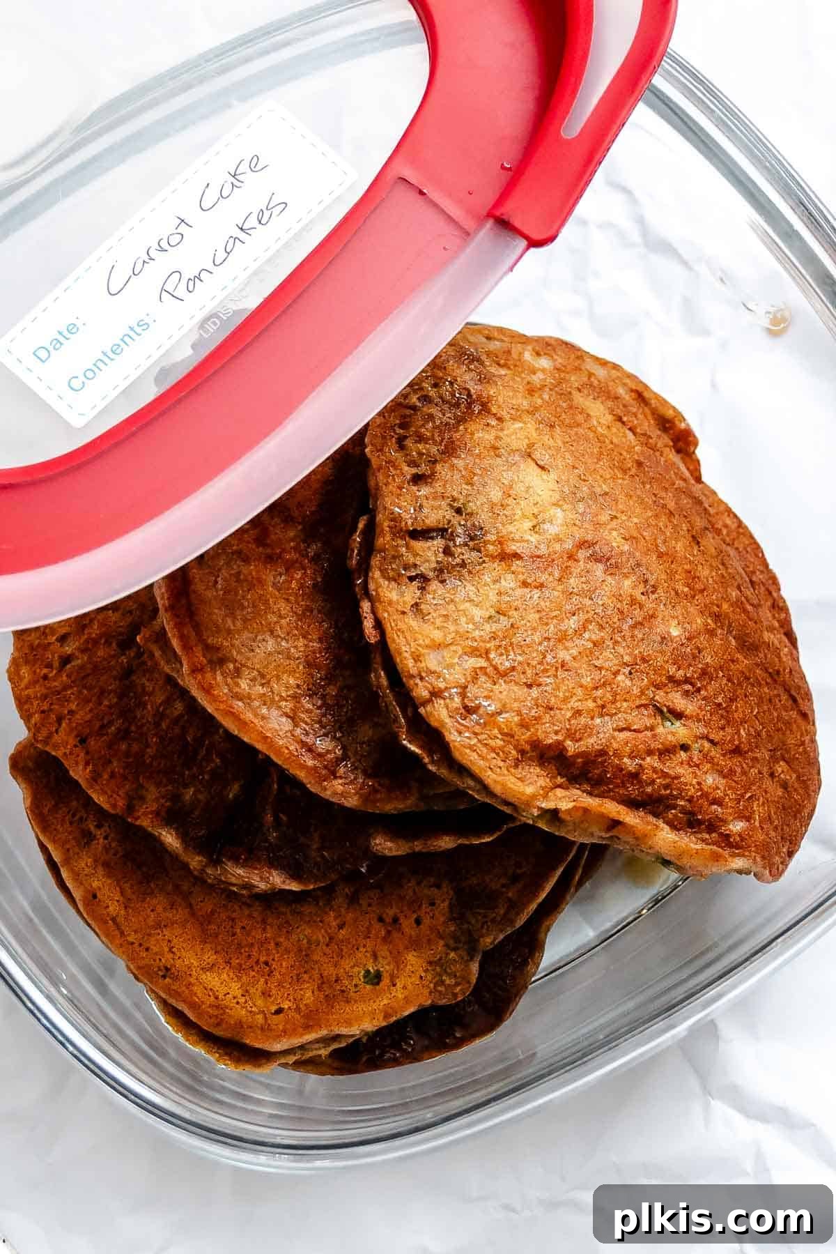 Spiced Carrot Cake Pancakes 9 Completed Carrot Cake Pancakes in a storage container.
