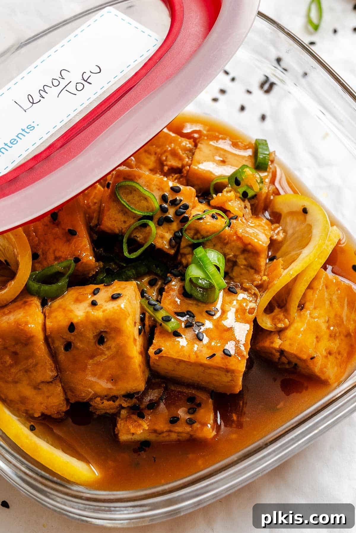 Zesty Lemon Glazed Tofu 8 Completed Sticky Lemon Tofu in a storage container, ready for meal prep.
