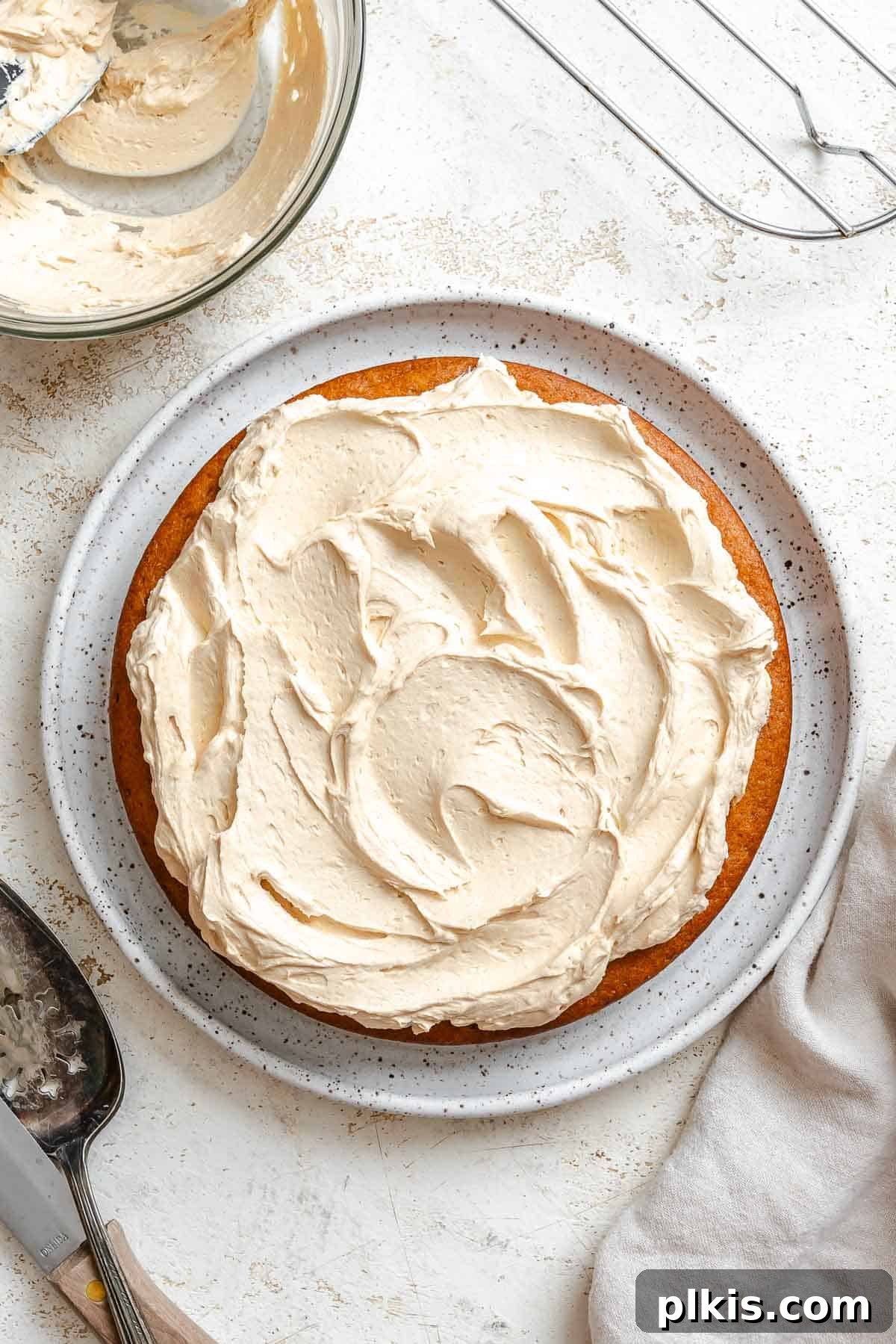 Rich Vegan Peanut Butter Bliss 2 Completed Vegan Peanut Butter Cake on a plate, showcasing its fluffy texture and creamy frosting.