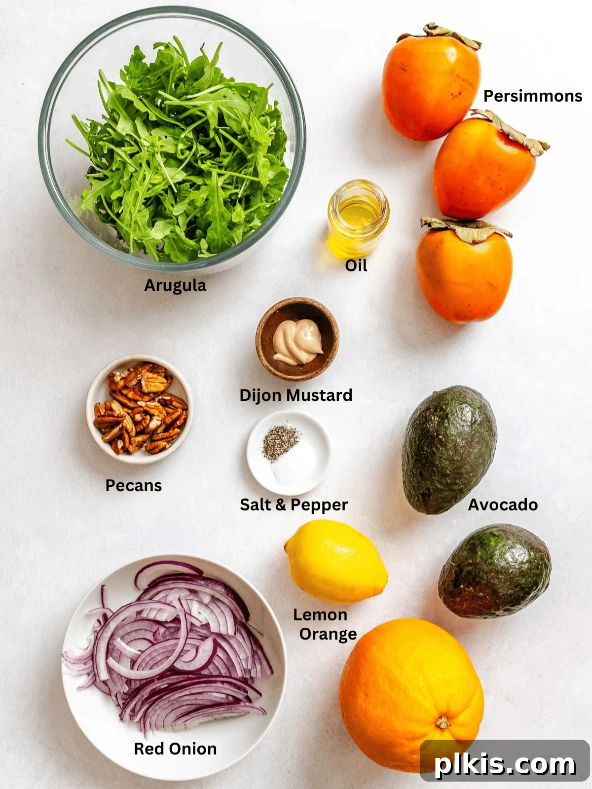 Golden Harvest Persimmon Salad 3 Ingredients for Persimmon Salad measured out on a white surface.