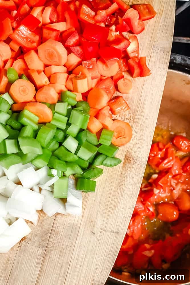 Hearty Quinoa and Vegetable Soup Recipe for Comforting Meals 5 process shot of adding veggies to pot