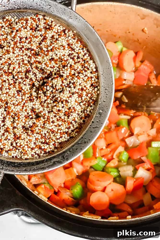 Hearty Quinoa and Vegetable Soup Recipe for Comforting Meals 6 process shot of adding quinoa to pot