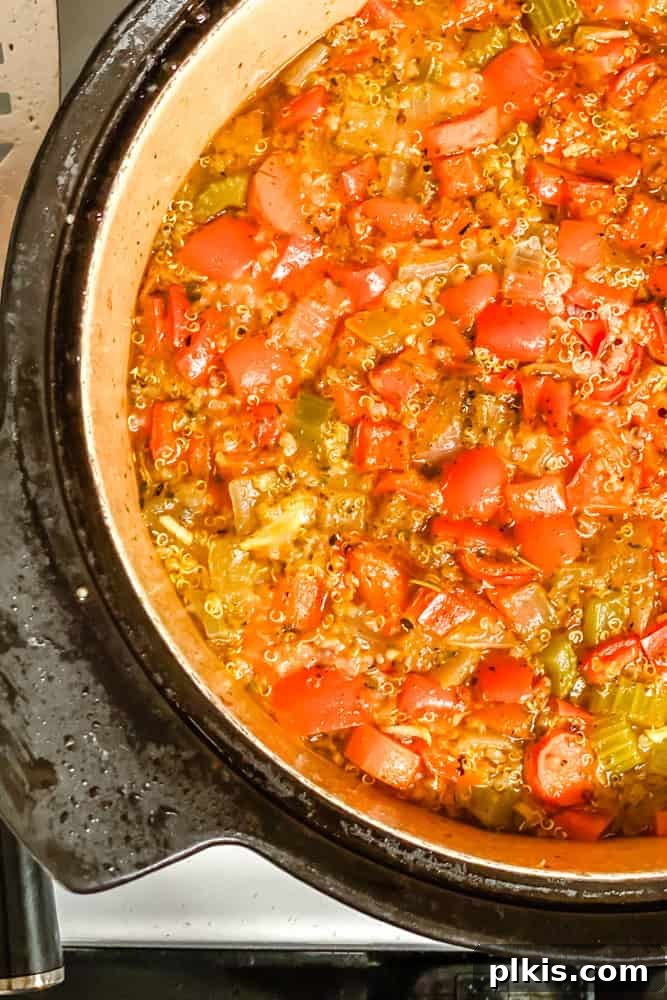 Hearty Quinoa and Vegetable Soup Recipe for Comforting Meals 7 process shot of soup cooking in pot