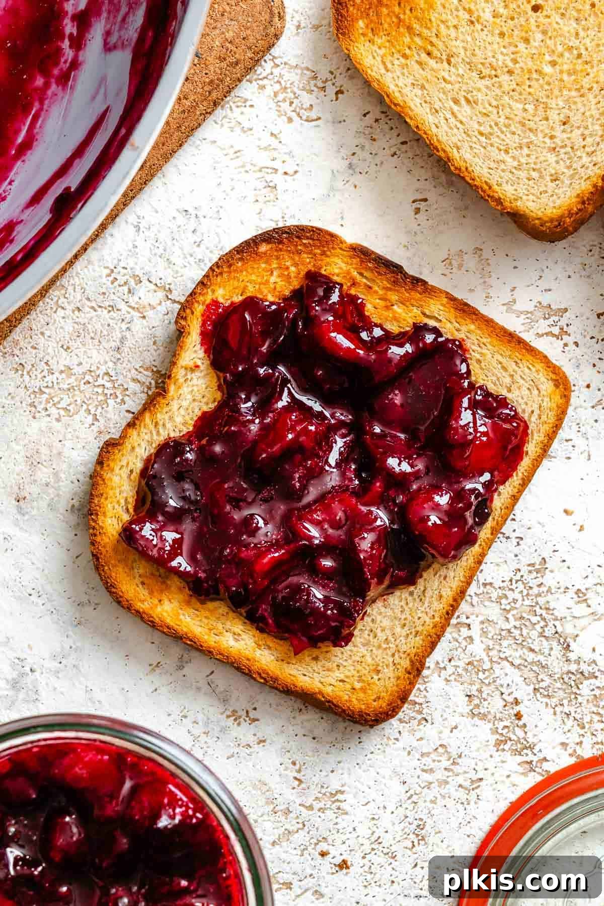 Homemade Plum Jam Without Pectin — Simple Stove-Top Recipe 6 Completed Easy Plum Jam (No Pectin) spread onto a piece of bread.