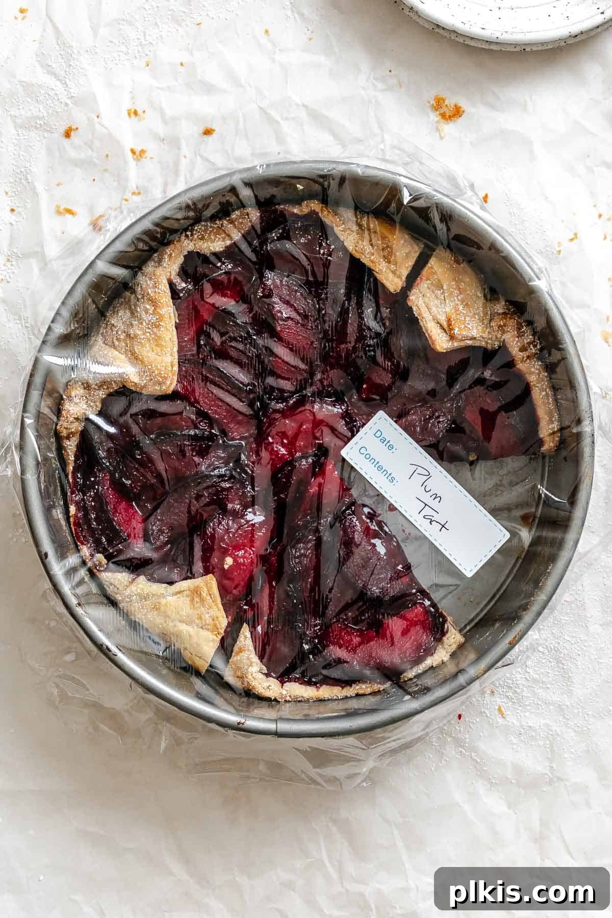 Classic Plum Galette Recipe: Homemade Rustic Tart with Fresh Plums 11 Completed Easy Plum Tart (Plum Galette) wrapped in plastic wrap.