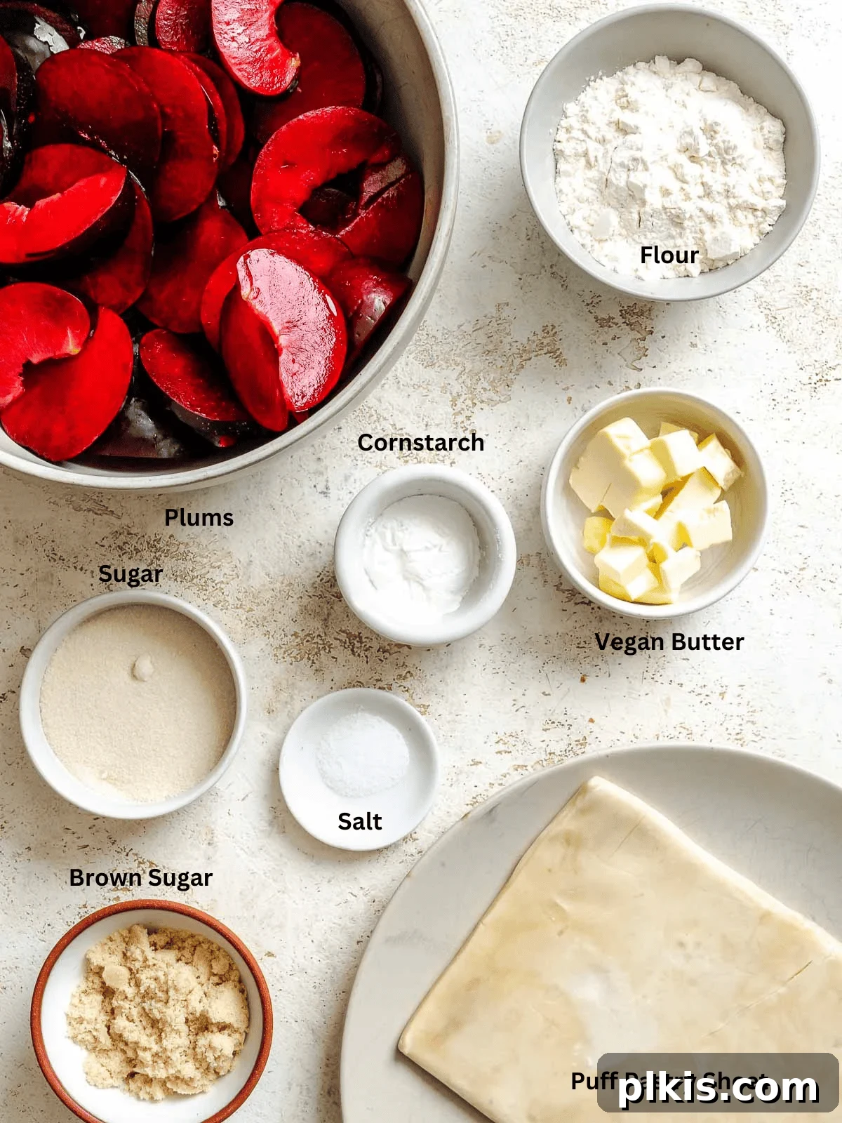 Classic Plum Galette Recipe: Homemade Rustic Tart with Fresh Plums 3 Ingredients for Easy Plum Tart (Plum Galette) measured out on a white surface.