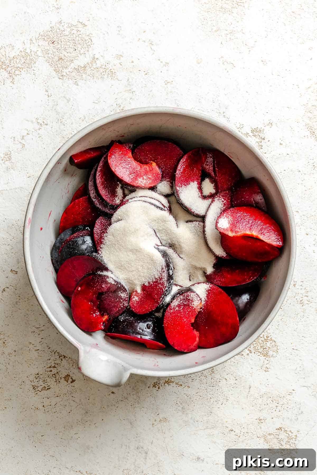 Classic Plum Galette Recipe: Homemade Rustic Tart with Fresh Plums 4 Process shot showing ingredients in a bowl for Easy Plum Tart (Plum Galette).