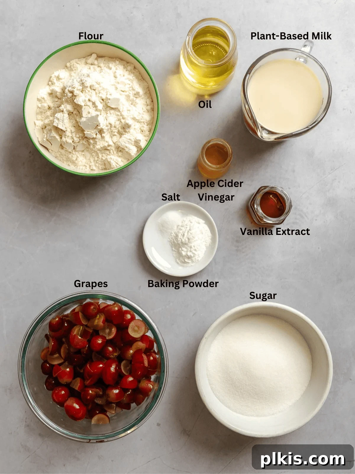 Egg-Free Grape Muffins Recipe 3 Ingredients for Grape Muffins (Egg-Free) measured out on a white surface.