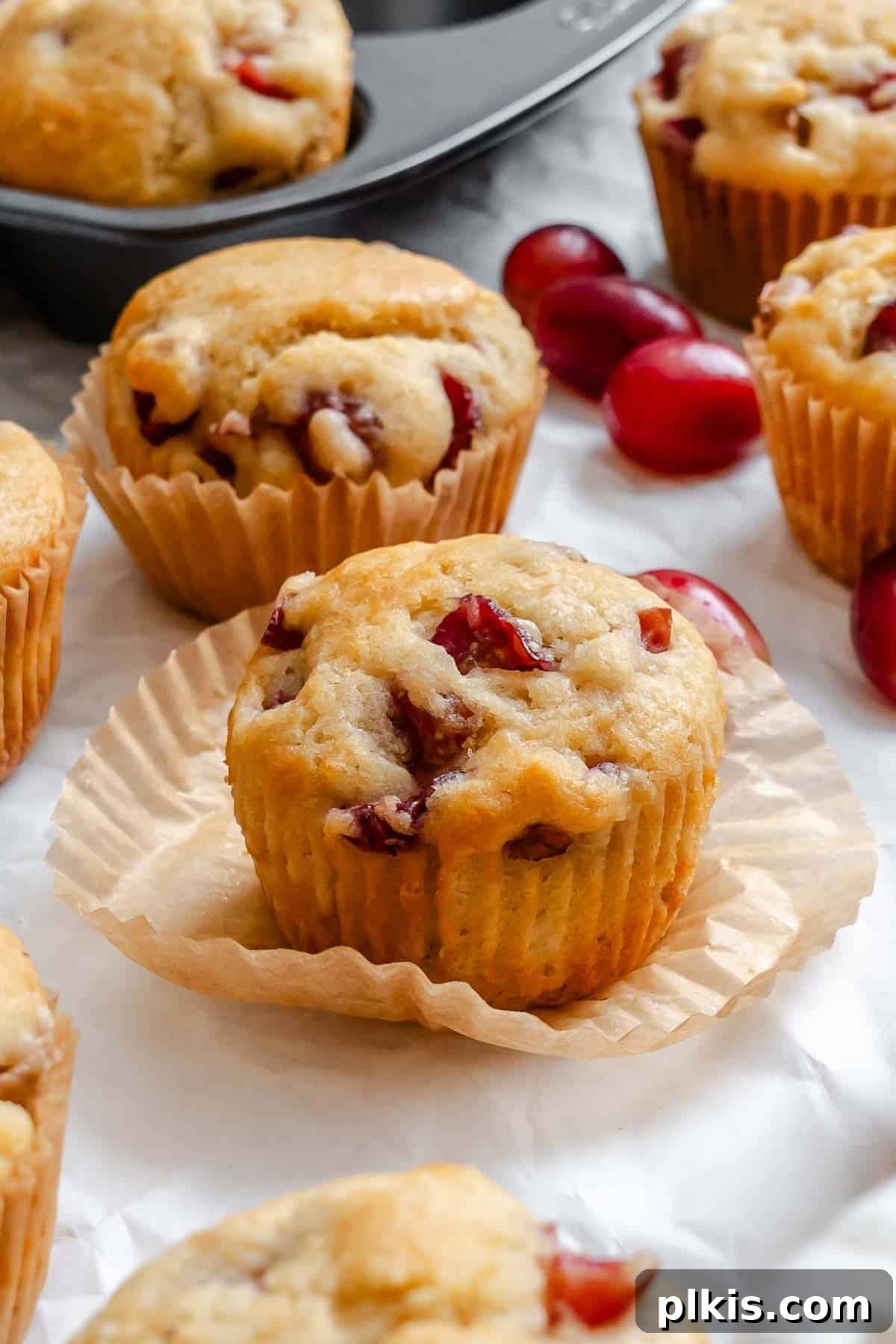 Egg-Free Grape Muffins Recipe 8 Completed Grape Muffins (Egg-Free) on a white surface.