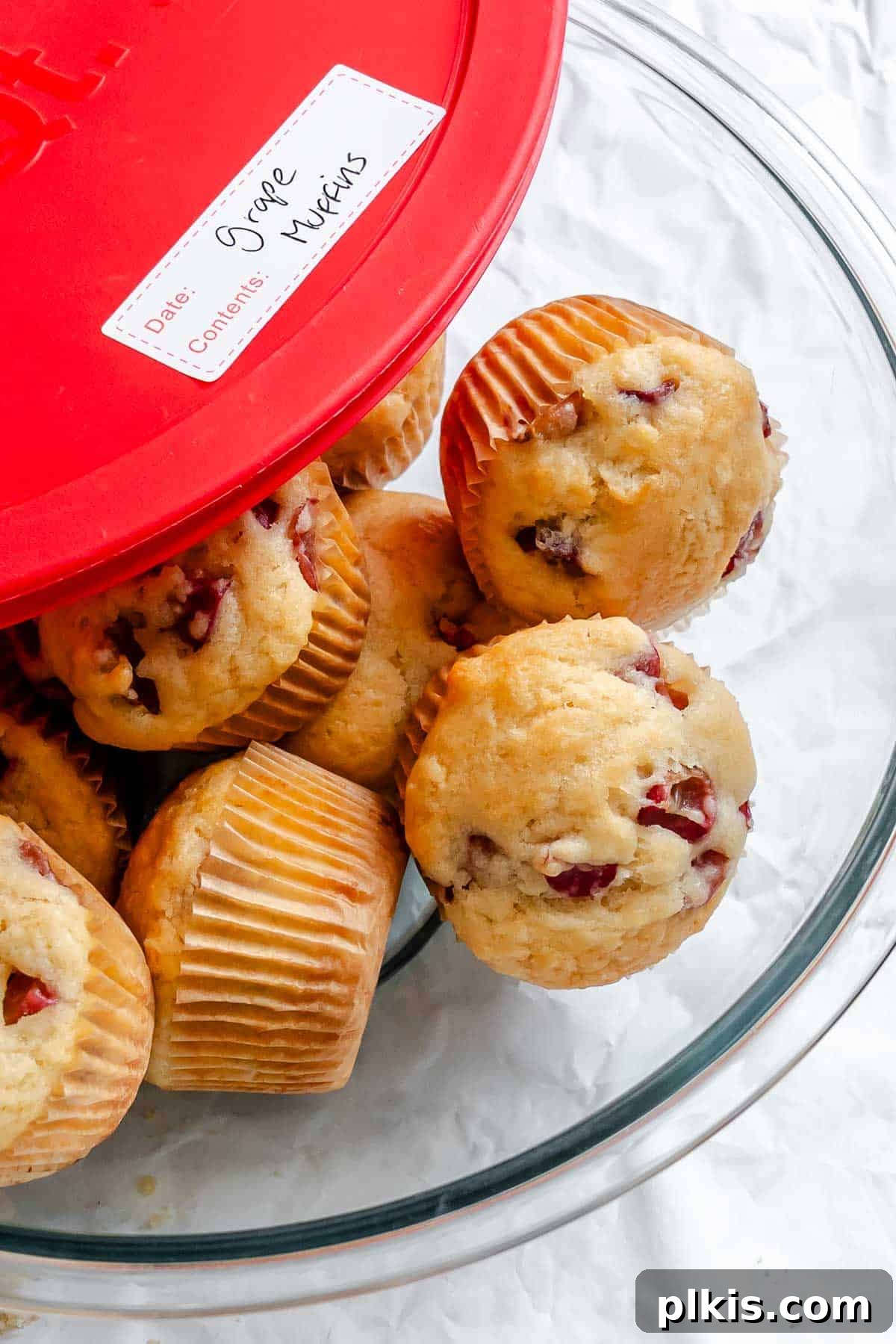 Egg-Free Grape Muffins Recipe 9 Completed Grape Muffins (Egg-Free) in a storage container.