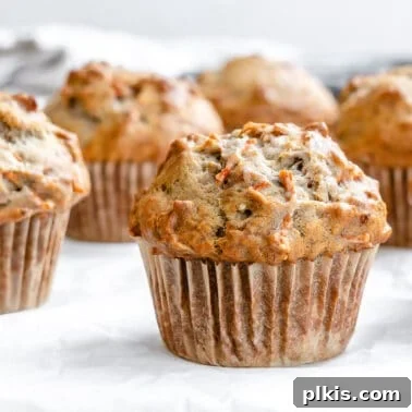 Egg-Free Grape Muffins Recipe 10 close up of completed Carrot Cake Muffin with several in the background