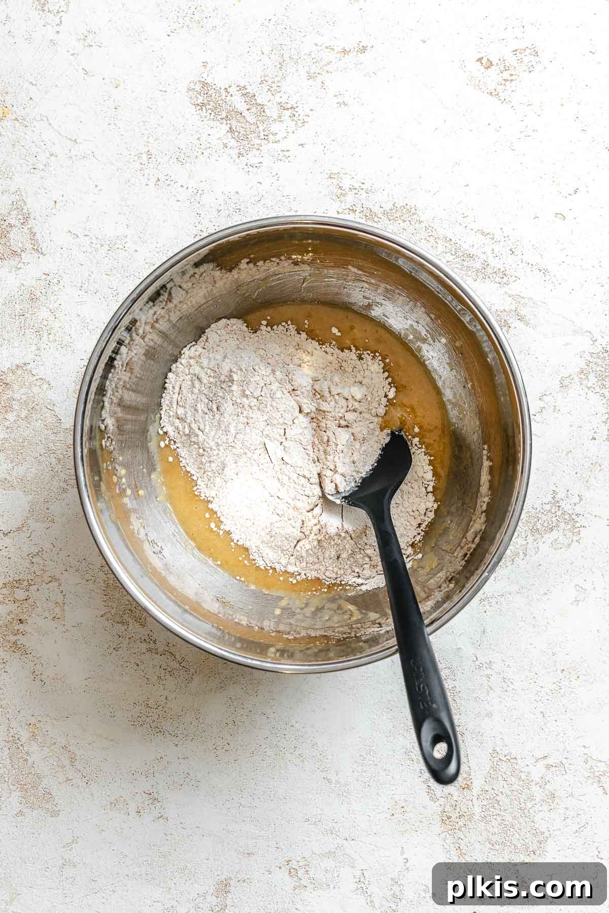 Soft Chewy Banana Bread Cookies Recipe 5 Process shot showing mixing ingredients together in a bowl.