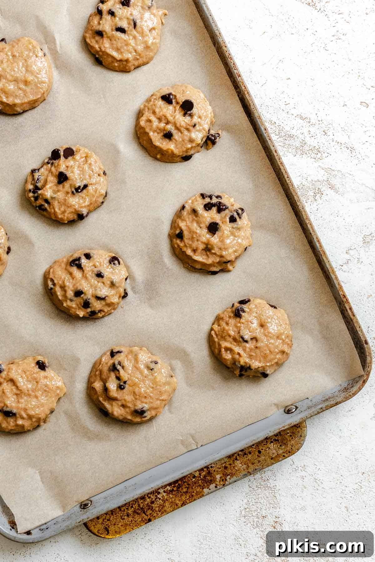 Soft Chewy Banana Bread Cookies Recipe 7 Process shot showing cookies added to baking sheet.