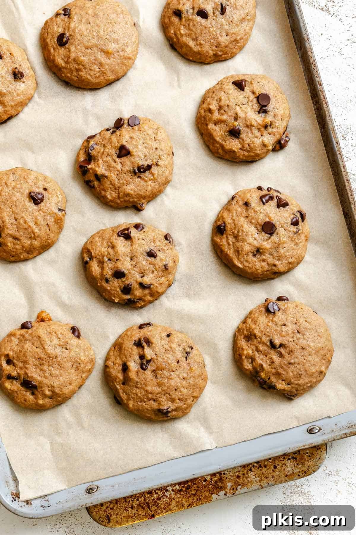 Soft Chewy Banana Bread Cookies Recipe 8 Process shot showing post baked cookies on baking sheet.
