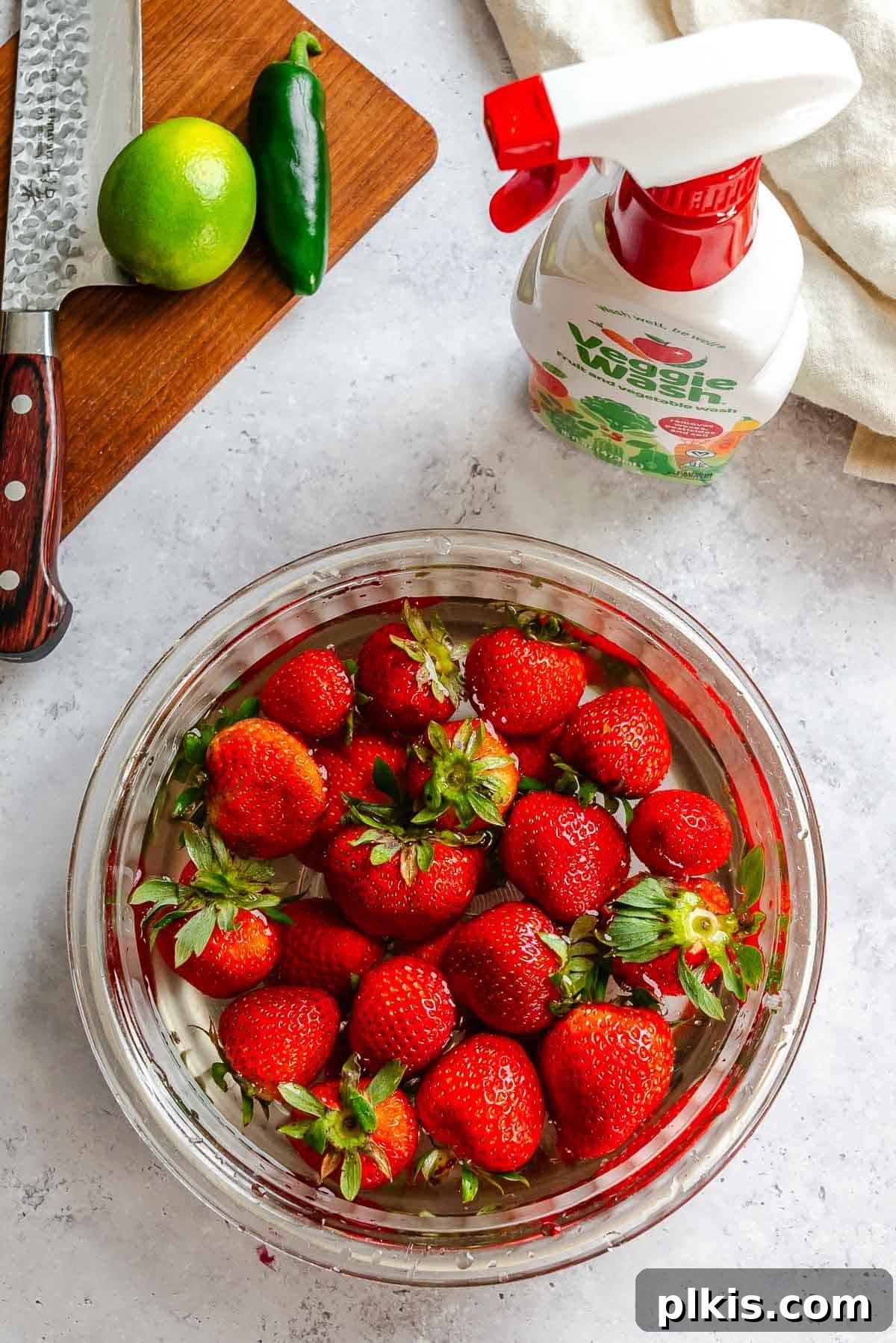 Fresh Strawberry Salsa: Sweet, Tangy Summer Recipe 4 Photos of strawberries in a bowl alongside veggie wash.