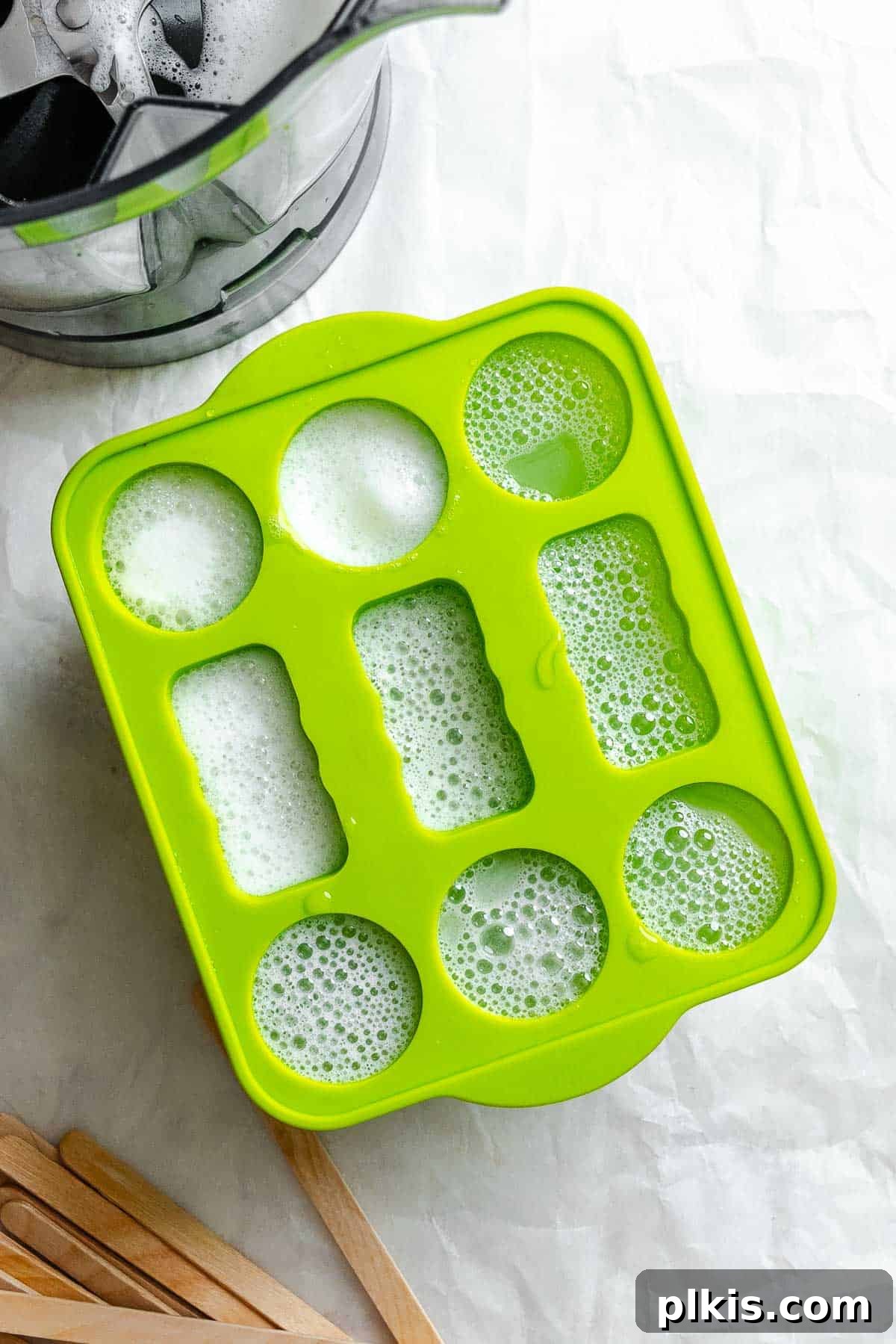 Homemade Zesty Lime Popsicles Recipe 5 Process shot showing ingredients added to popsicle mold.