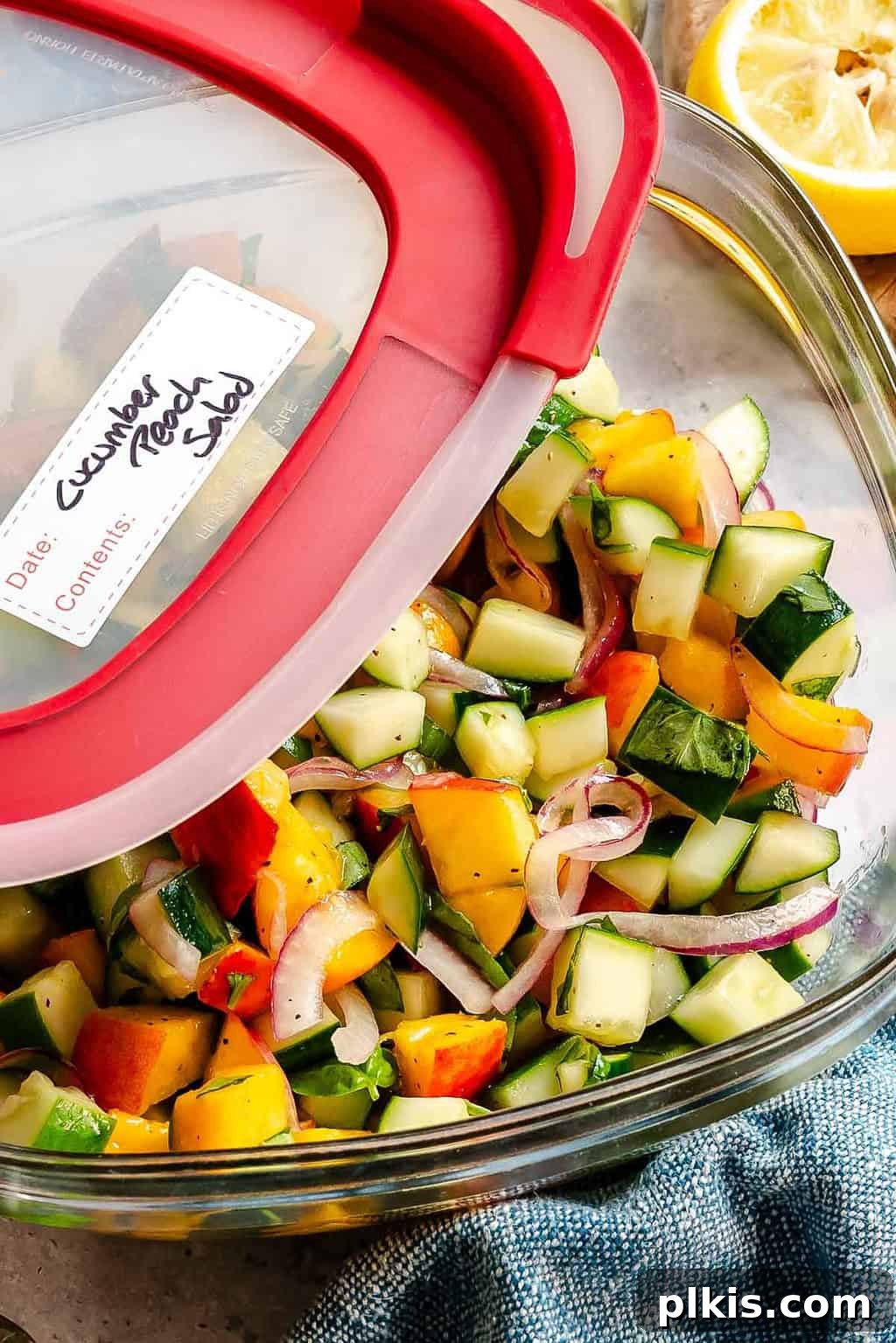 Cucumber and Peach Salad with Mint Lemon Vinaigrette 9 Completed Cucumber Peach Salad in a storage container.