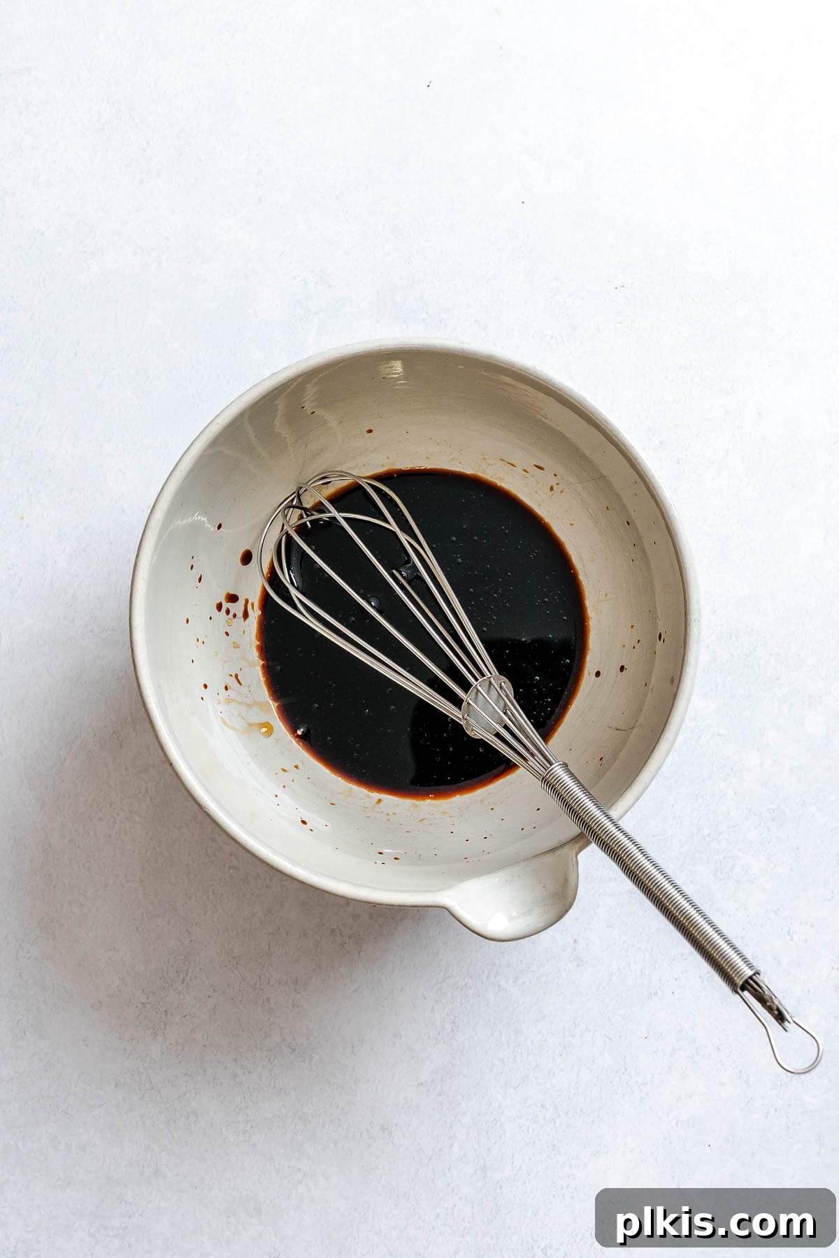 Mixing the marinade in a bowl.