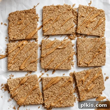 Chocolate Banana Baked Oatmeal with Peanut Butter Swirl 14 completed Peanut Butter Oatmeal Bars on a white surface