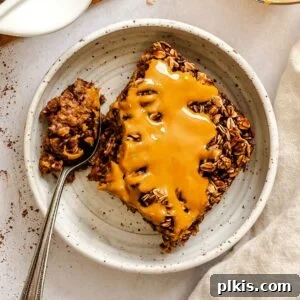 Chocolate Banana Baked Oatmeal with Peanut Butter Swirl 15 Completed Chocolate Banana Baked Oatmeal (with peanut butter) on a plate.