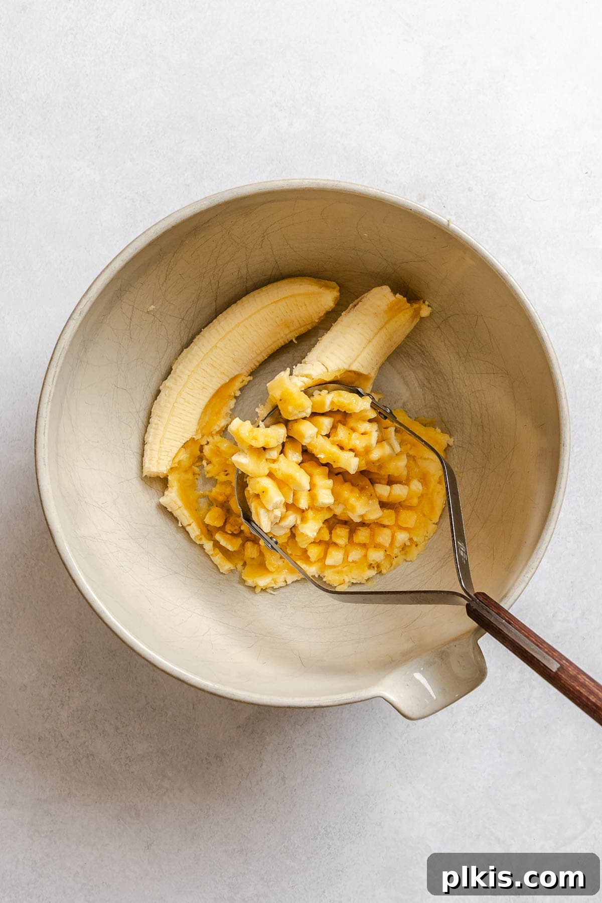 Chocolate Banana Baked Oatmeal with Peanut Butter Swirl 4 Process shot showing mashing bananas.