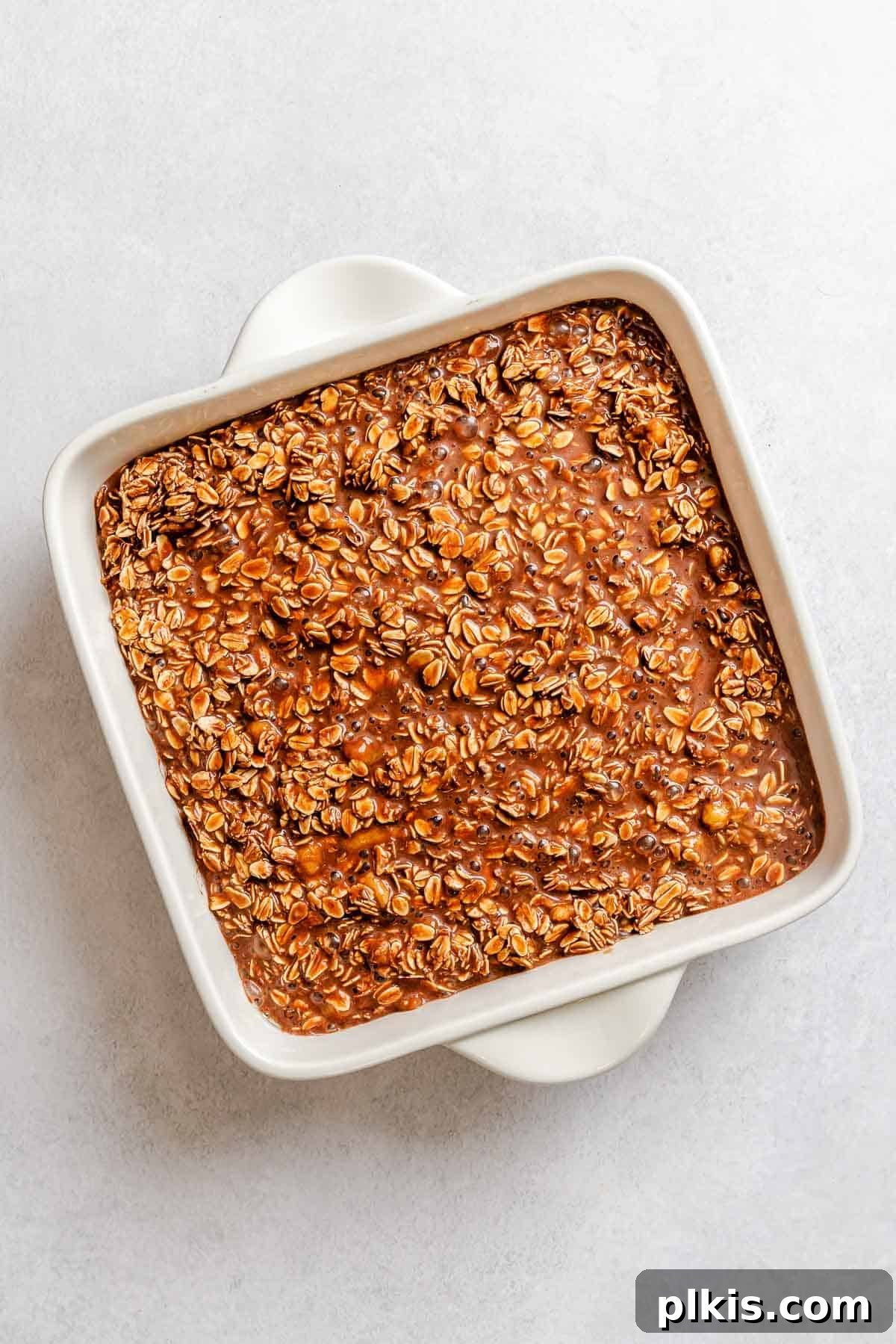 Chocolate Banana Baked Oatmeal with Peanut Butter Swirl 7 Process shot showing ingredients added to baking dish.