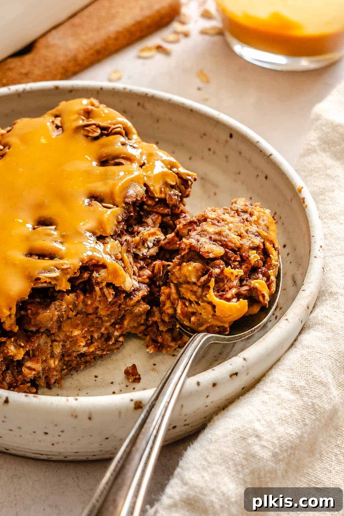 Chocolate Banana Baked Oatmeal with Peanut Butter Swirl 9 Completed Chocolate Banana Baked Oatmeal (with peanut butter) on a plate.