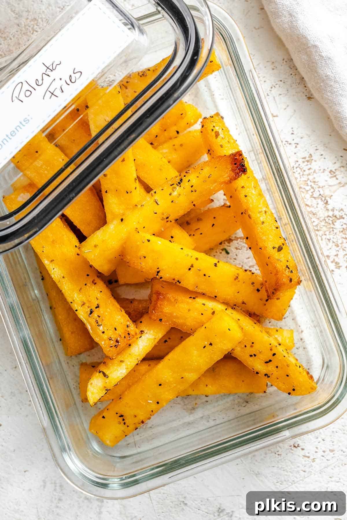 Completed Simple Polenta Fries in a storage container.