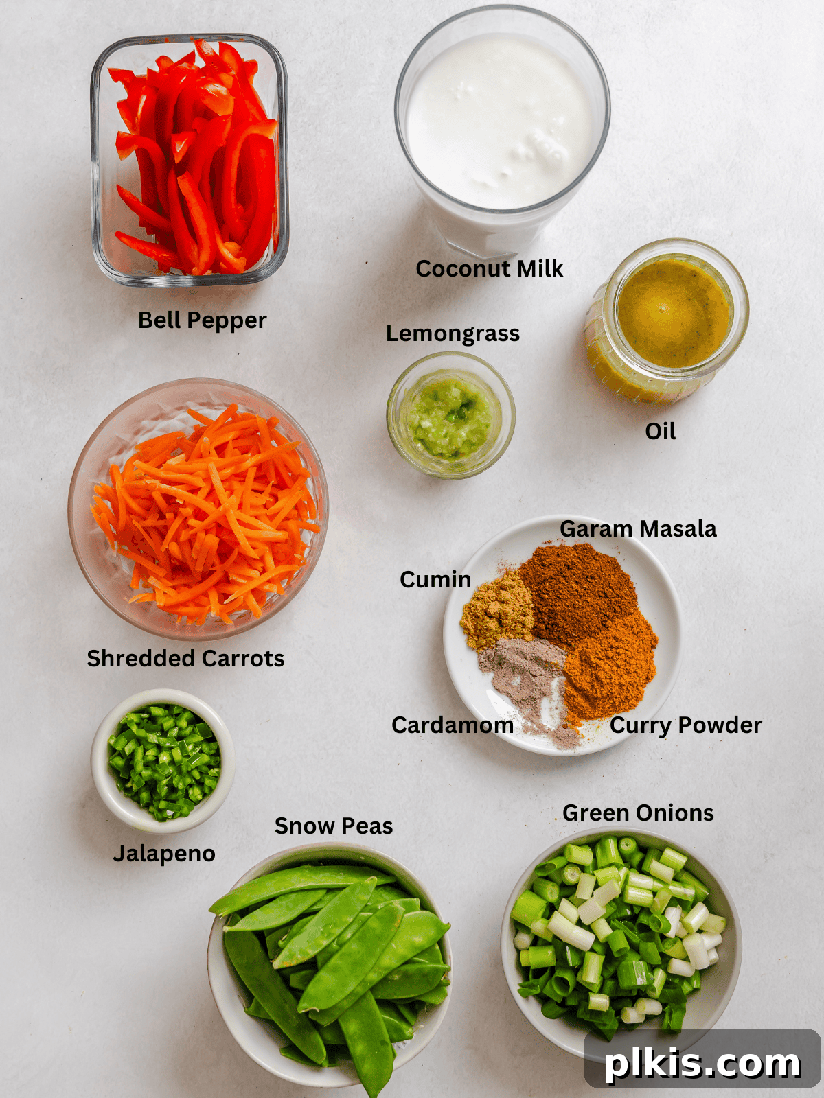Ingredients for Easy Vegan Curry measured out on a white surface.