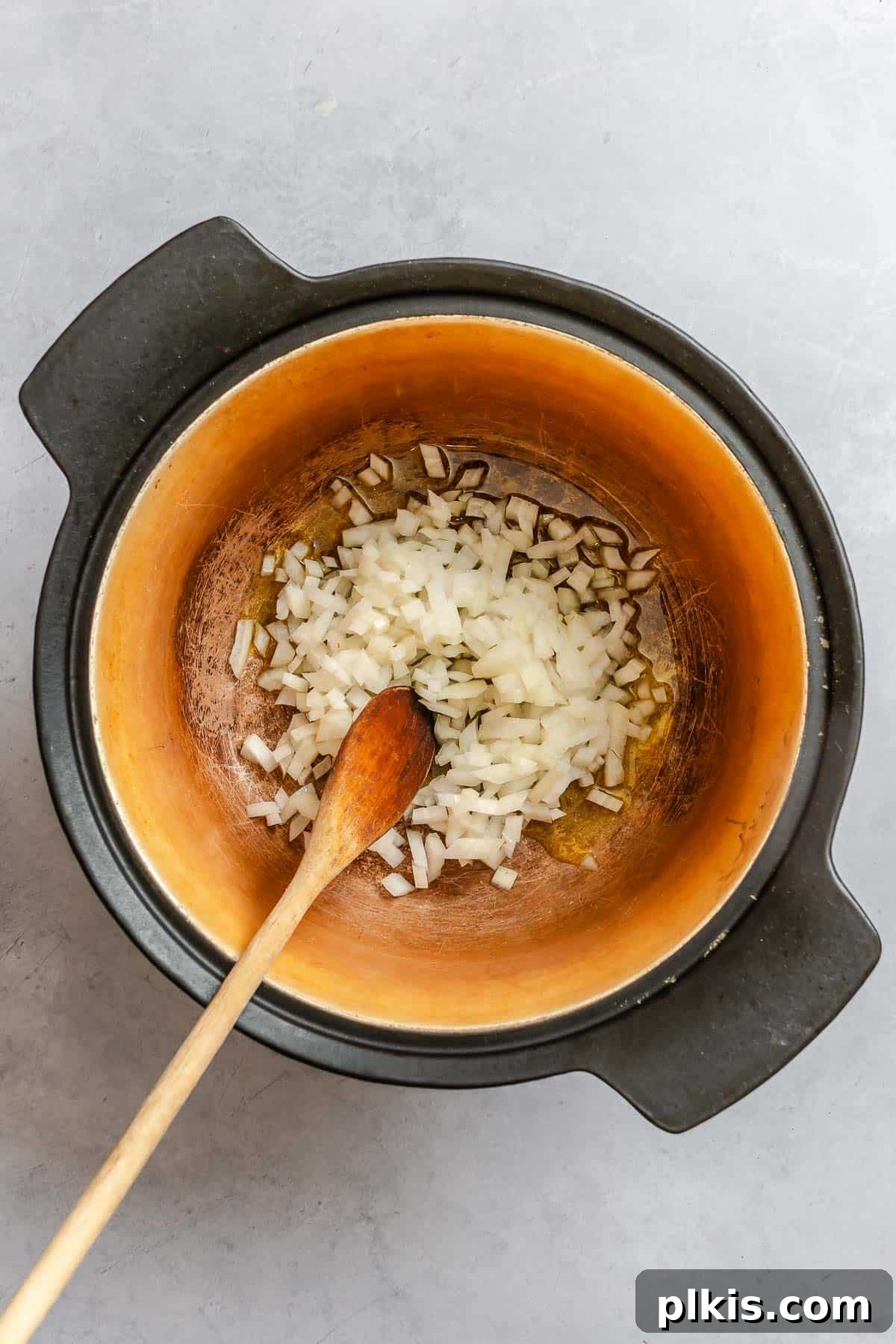 Process shot showing stirring ingredients in a bowl.