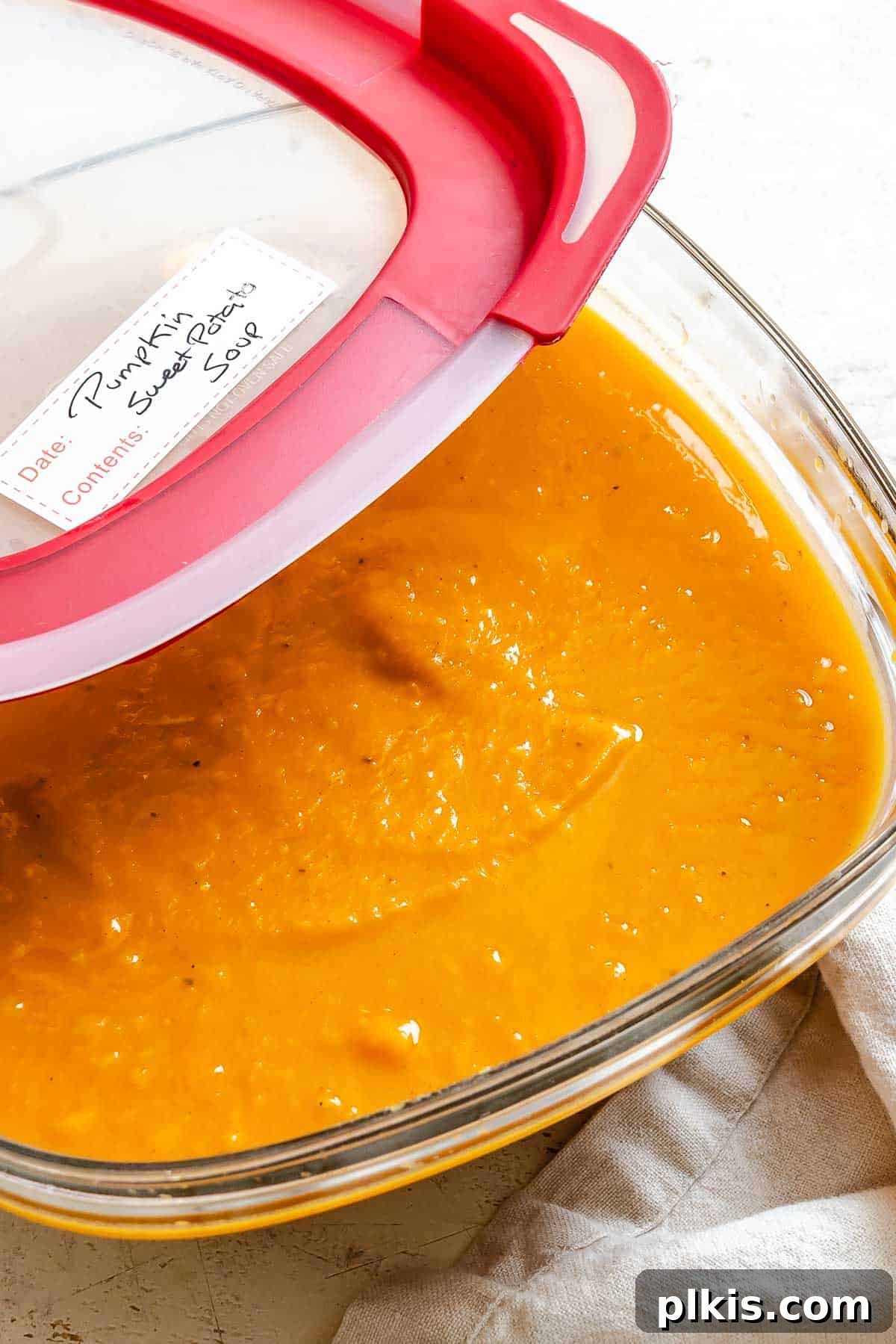Completed Sweet Potato Pumpkin Soup in a storage container.