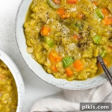 completed Vegan Split Pea Soup in a white bowl against a white surface