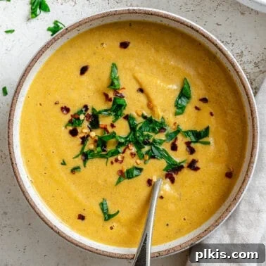 Creamy Curried Butternut Squash Soup 11 Slow Cooker Pumpkin Soup on a white surface