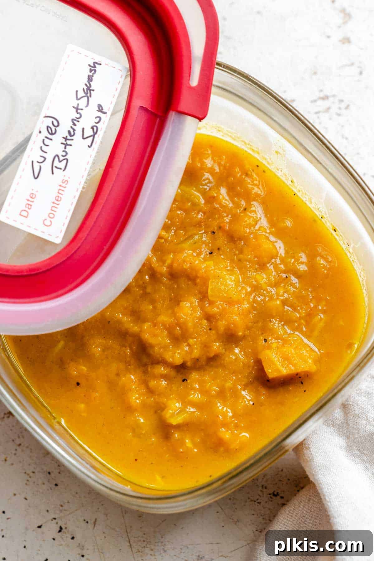 Creamy Curried Butternut Squash Soup 9 Completed Curried Butternut Squash Soup in a storage container.